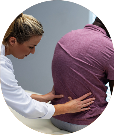 chiropractor treating a patient's lower back