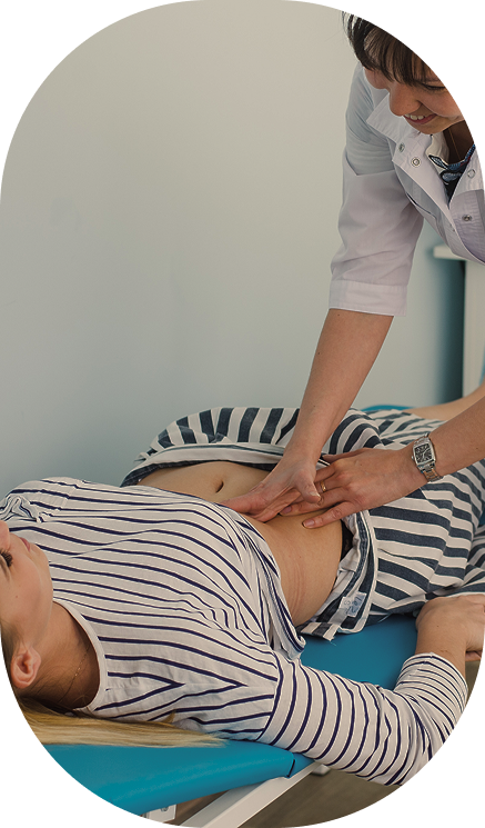 woman laying on her back receiving postpartum chiropractic care