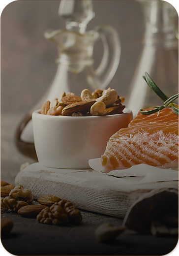 food sitting on a table, salmon, and a bowl of nuts