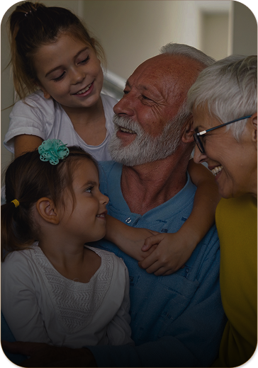 older couple with two young girls