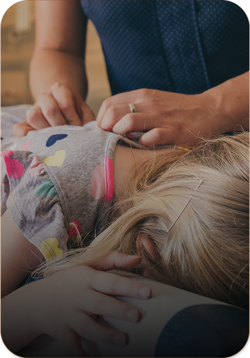 young girl receiving pediatric chiropractic care