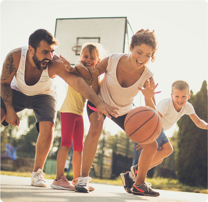 Family playing basketball